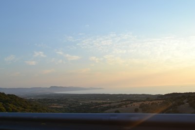 Hills overlooking the ocean at sunset